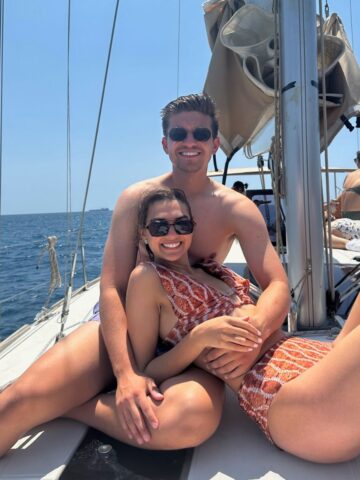 Couple in on a boat in Barcelona in June